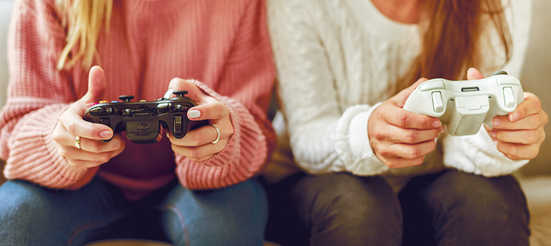 Women playing video game together